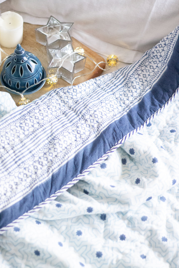 Light blue and dark blue geometric AC quilt