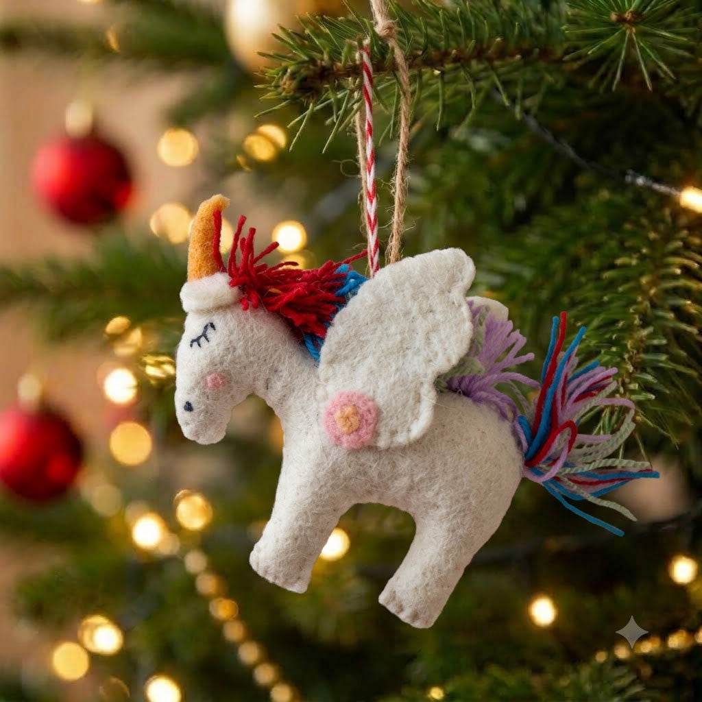 Twinkle the Rainbow Unicorn felt Christmas ornament hanging on a Christmas tree