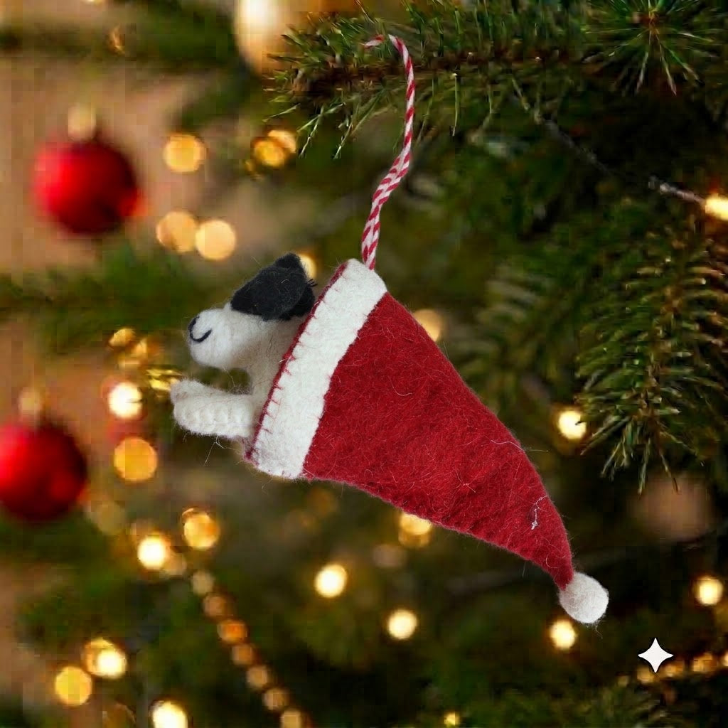 Puppy Jack felt puppy in a red Santa cap Christmas ornament hanging on a Christmas tree