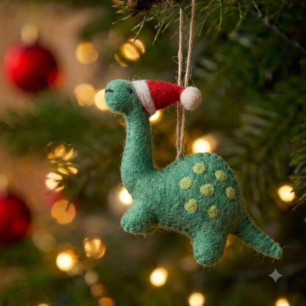 Tree Rex green felt dinosaur Christmas ornament in a Santa hat on a Christmas tree