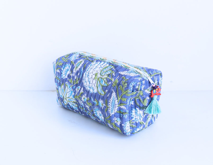 Blue floral patterned pouch on a white background