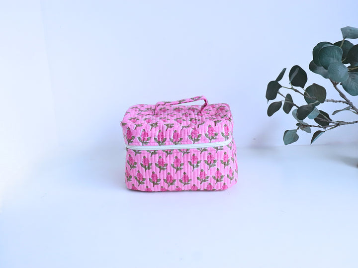Inside view of dark pink block print vanity bag showing spacious interior and secure zip