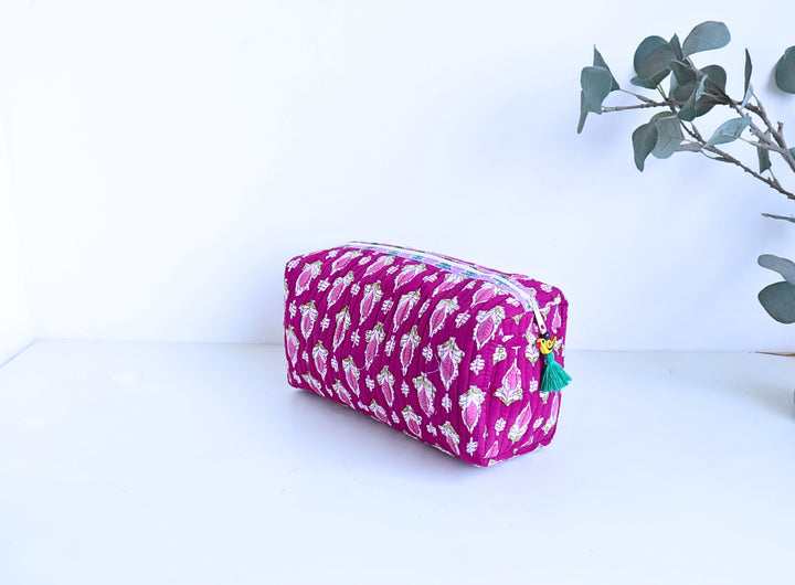 Dark pink hand block printed travel makeup pouch open showing block printed lining