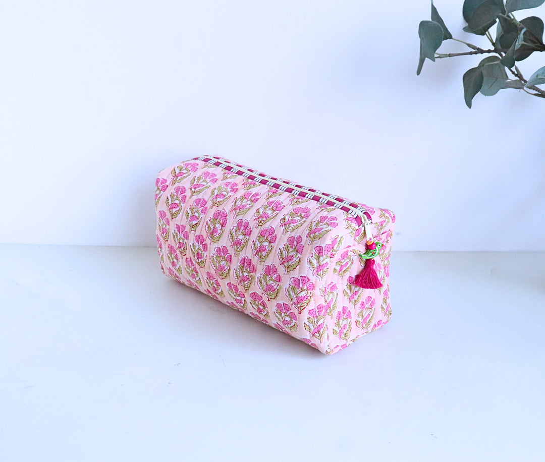Hand block printed peach booti large cosmetic bag by Kari by Kriti, flat lay