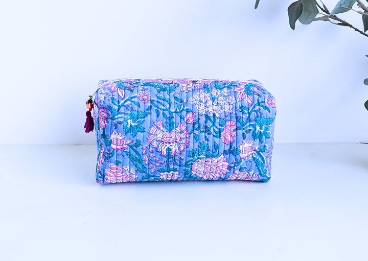 Hand block printed large cosmetic bag in blue and pink floral print by Kari by Kriti