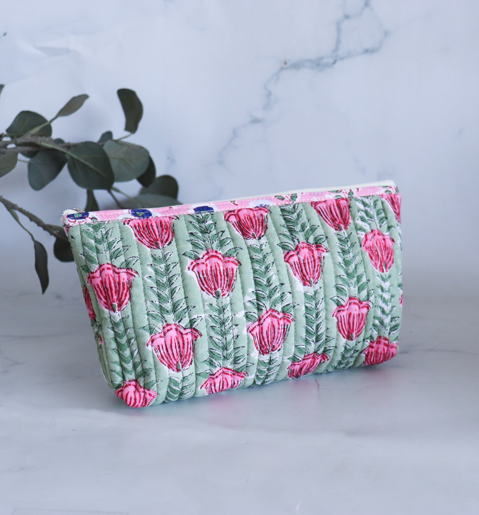 Quilted block print pencil pouch in blue floral pattern with hand-embroidered custom name, zip closure, handmade in India