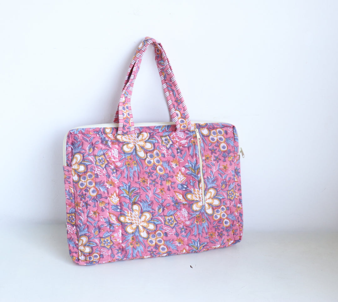 Close-up of pink floral hand block print detail on quilted cotton laptop bag
