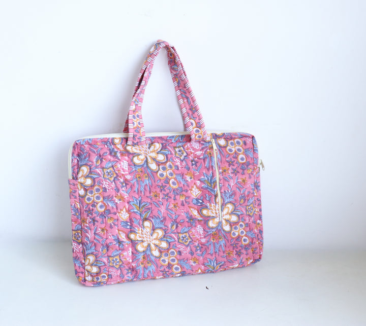 Close-up of pink floral hand block print detail on quilted cotton laptop bag