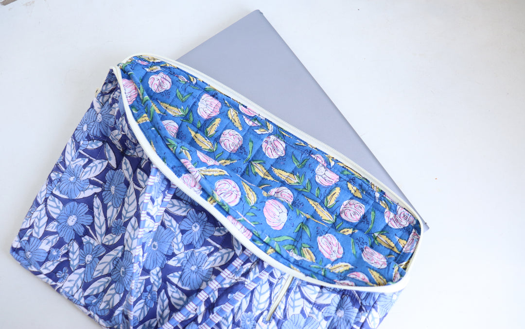 Blue Floral block print laptop bag flat lay on neutral background