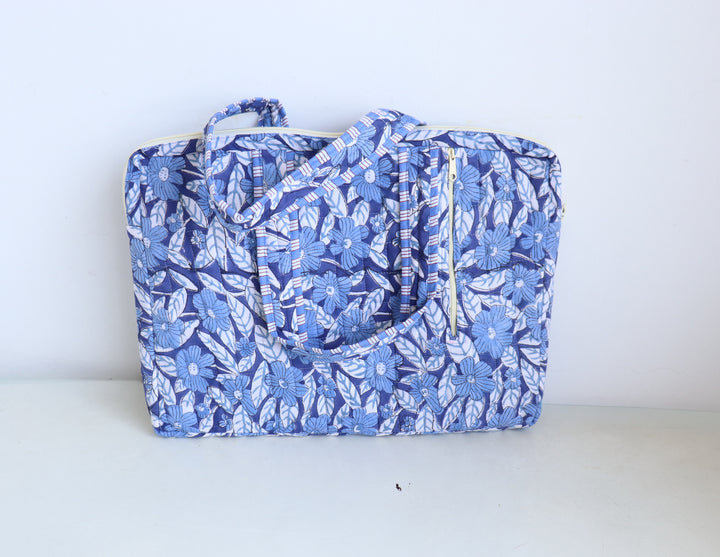 Laptop bag open showing padded interior and zip pockets