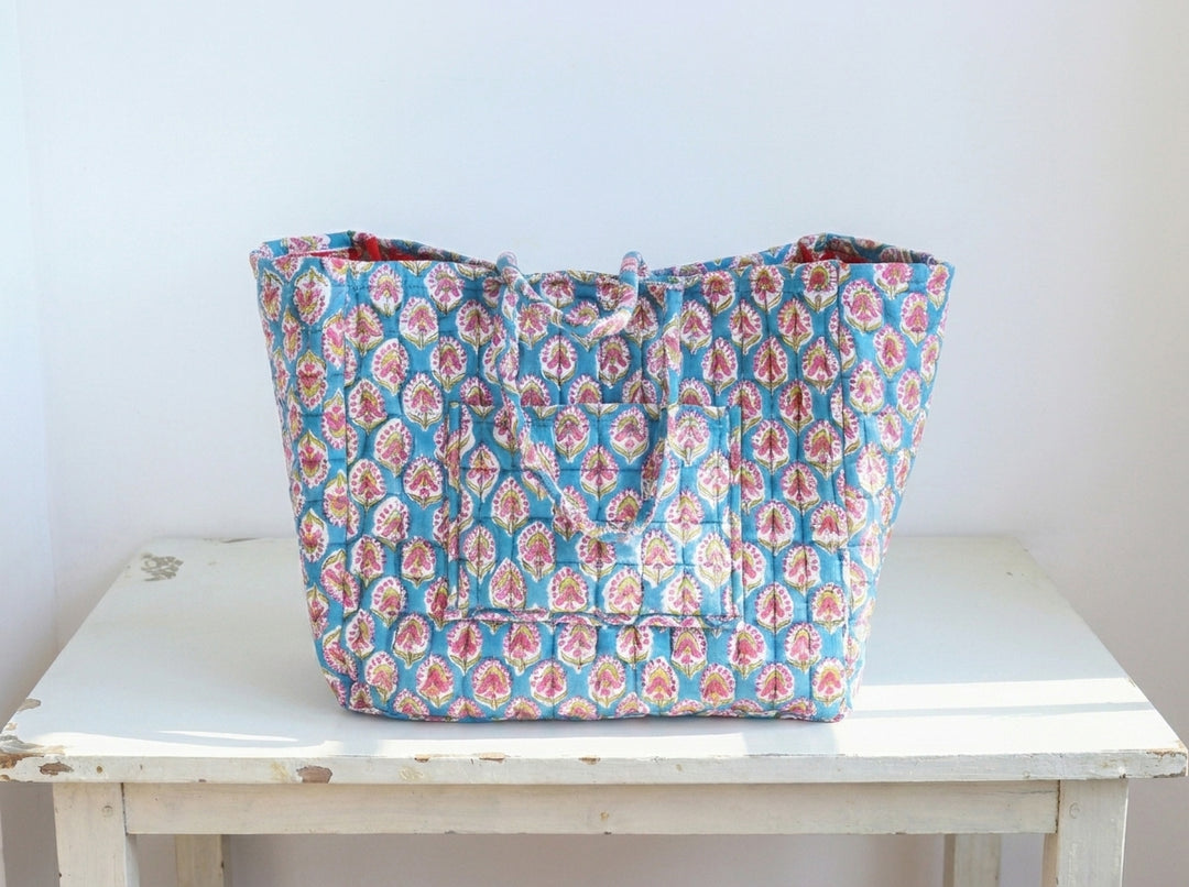 Close-up of teal booti hand block print pattern on XL cotton storage basket by Kari by Kriti