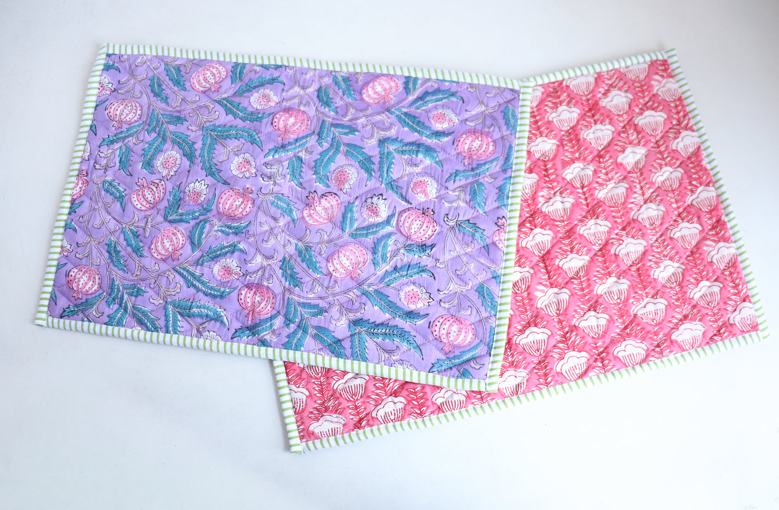 Lilac block print quilted reversible placemats set of 2, 13x19 inches, shown on a dining table
