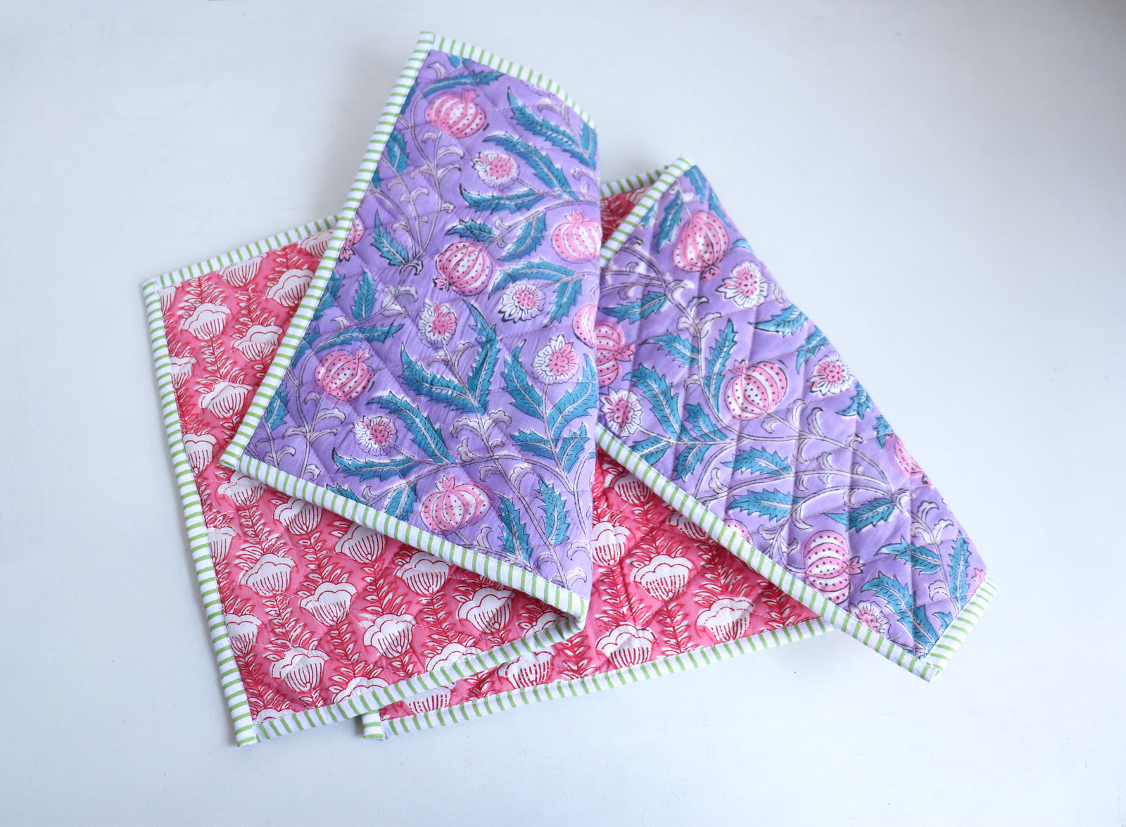 Close-up of lilac block print quilted placemat showing handcrafted print pattern and quilted texture