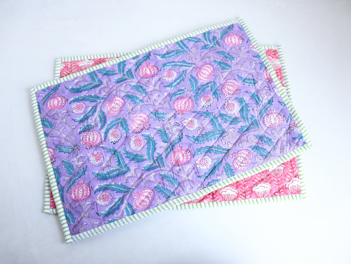 Reversible lilac block print placemat styled with dining setup, showing both sides of the design