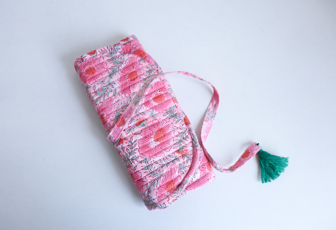 Block printed jewelry roll pouch tied with closure, compact and travel-ready, with embroidered name personalization detail
