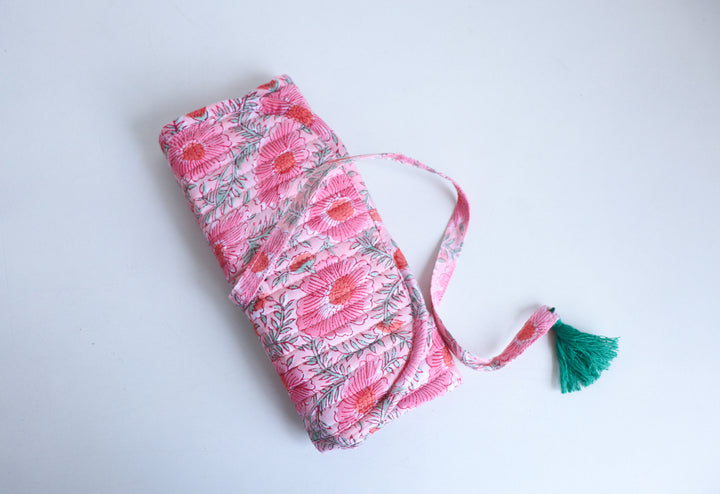 Block printed jewelry roll pouch tied with closure, compact and travel-ready, with embroidered name personalization detail
