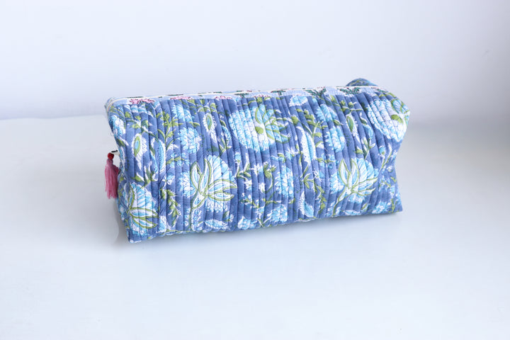 Block print Dyson Airwrap organizer bag in blue and green floral pattern, quilted cotton with tassel detail