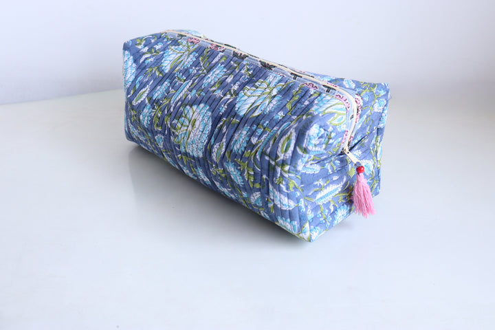 Blue green floral block print hair tool organizer bag open showing 6 pockets and printed inner lining