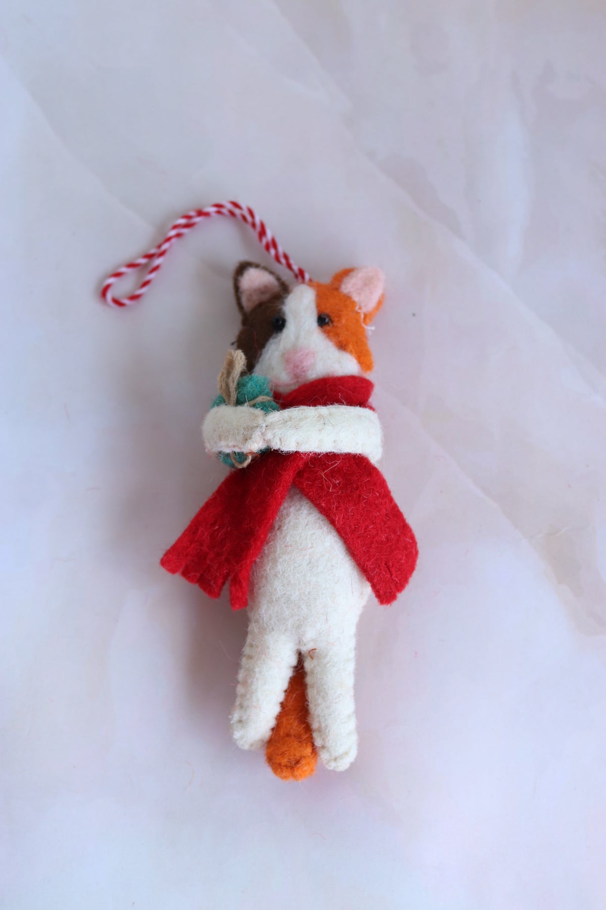 Sam the Gifty Cat handmade felt calico cat ornament in a red cape, front view
