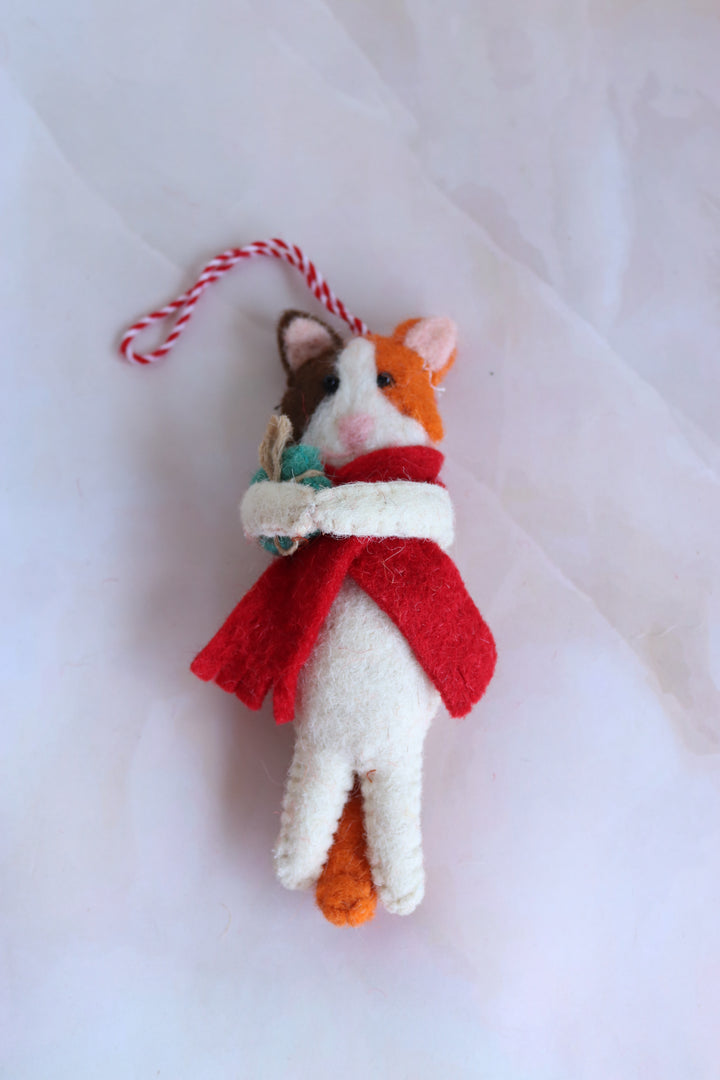 Sam the Gifty Cat handmade felt calico cat ornament in a red cape, front view