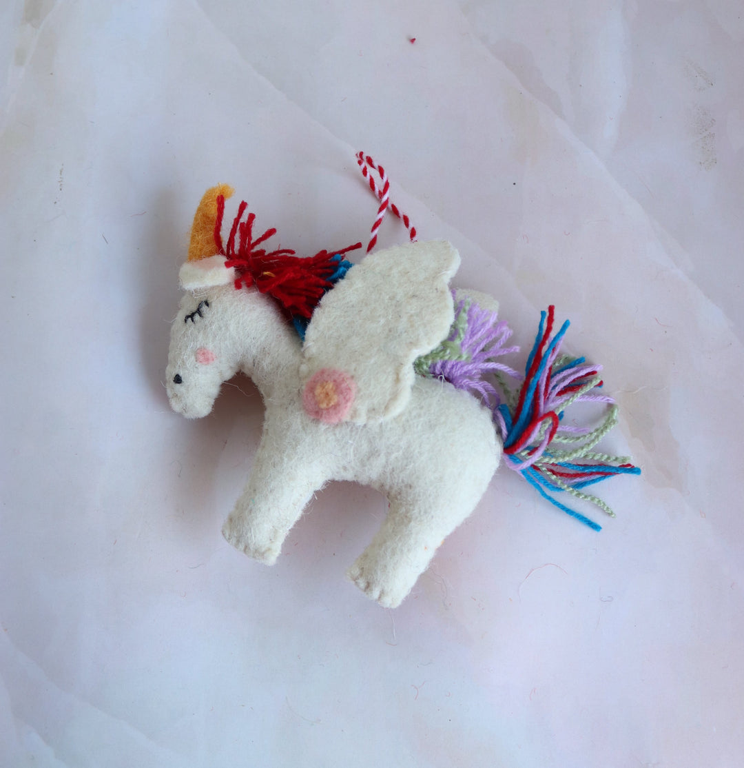 Twinkle the Rainbow Unicorn felt ornament, side view of the rainbow tail