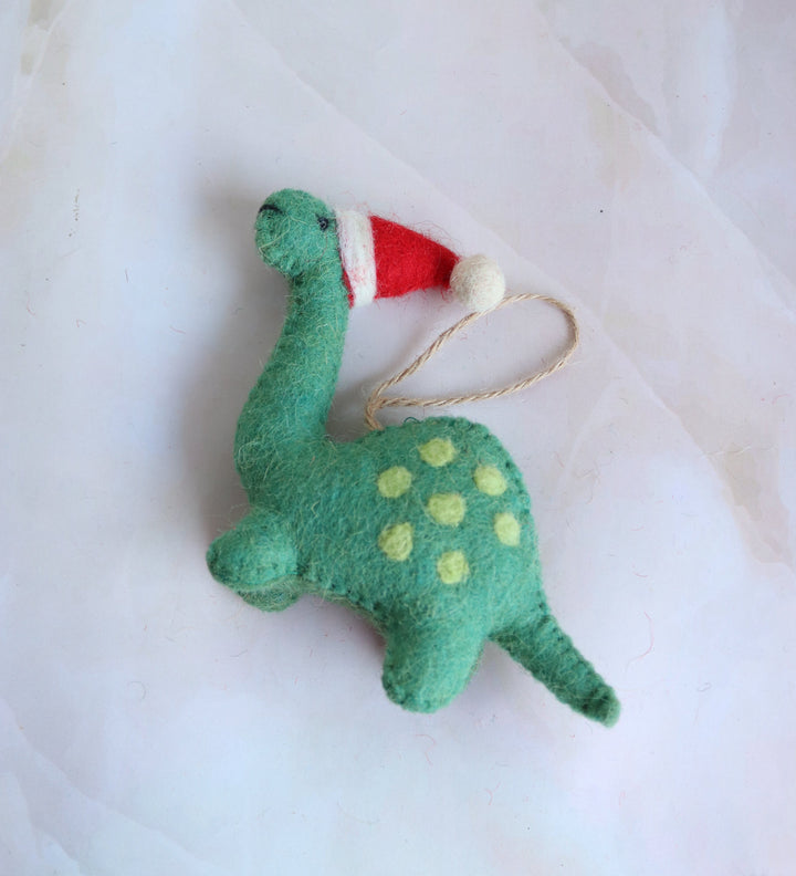 Tree Rex handmade felt dinosaur ornament with yellow spots and Santa hat, front view