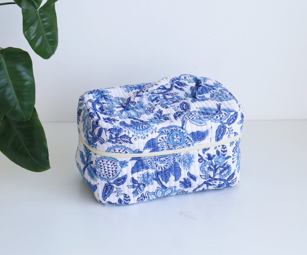Block print vanity bag in blue and yellow floral pattern, handmade toiletry case with zip closure