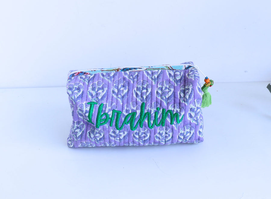 Purple pouch with 'Ibrahim' embroidered on it
