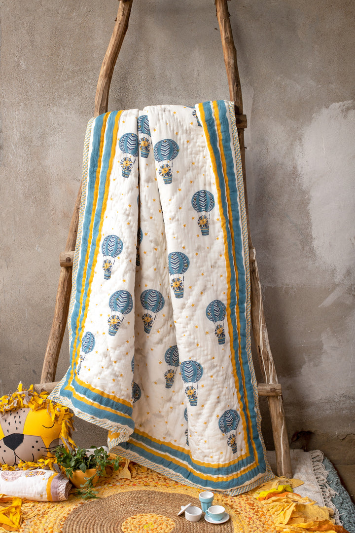 Personalised blue and yellow lion block print baby quilt with name
