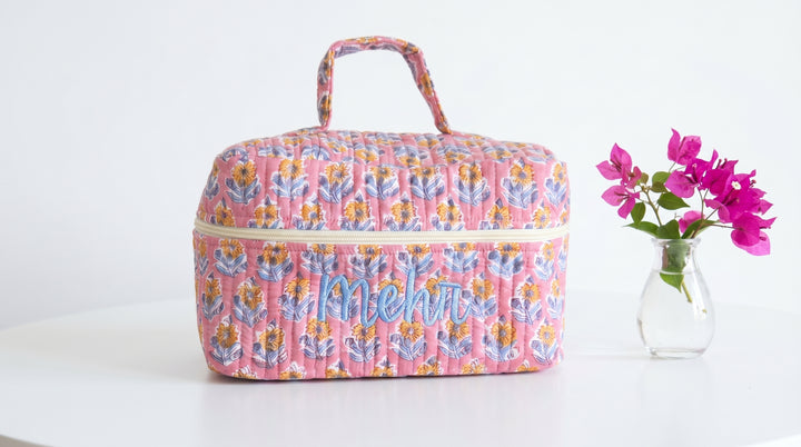 Hand block printed cotton train case with custom name, quilted texture in traditional Indian print
