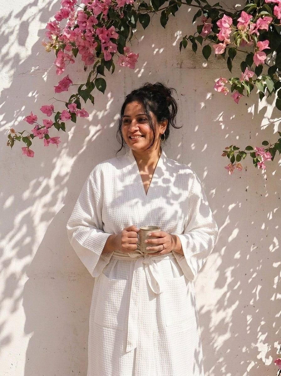 Block print cotton bath robe for women laid flat showing full length, blue and blush print with name embroidery