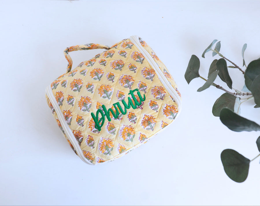 Personalized block print hanging travel bag with embroidered name
