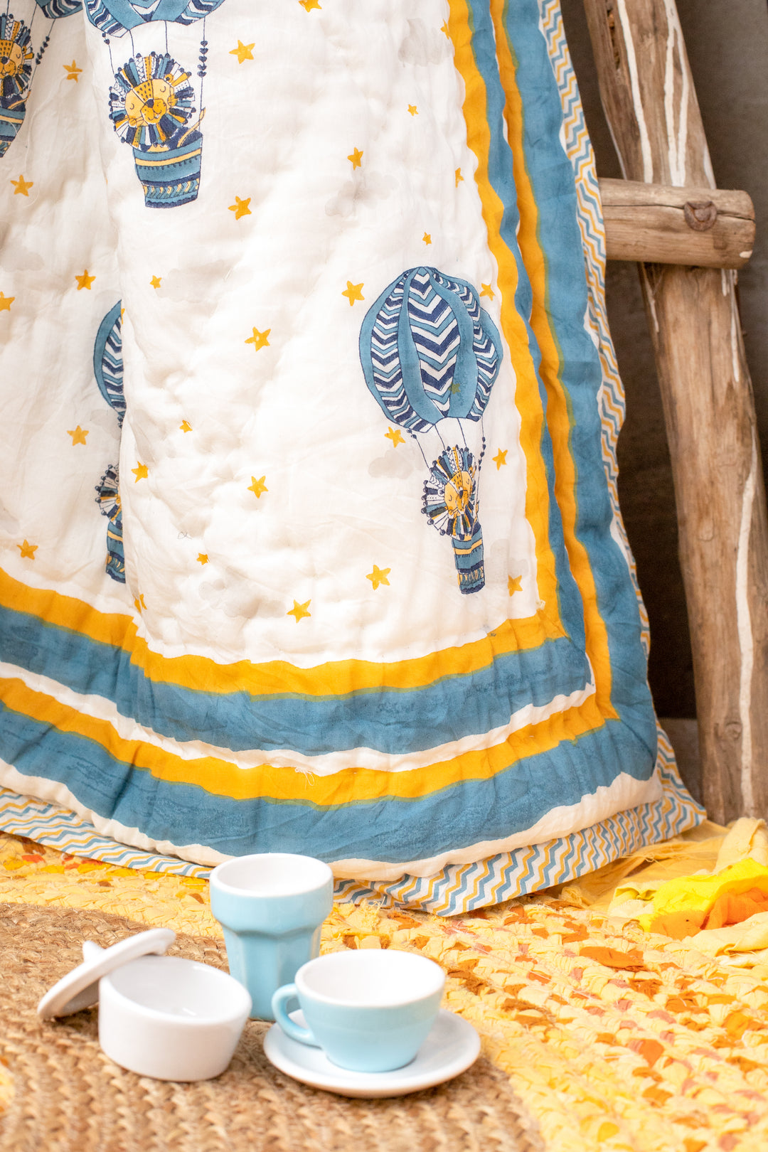 Personalised blue and yellow lion block print baby quilt with name
