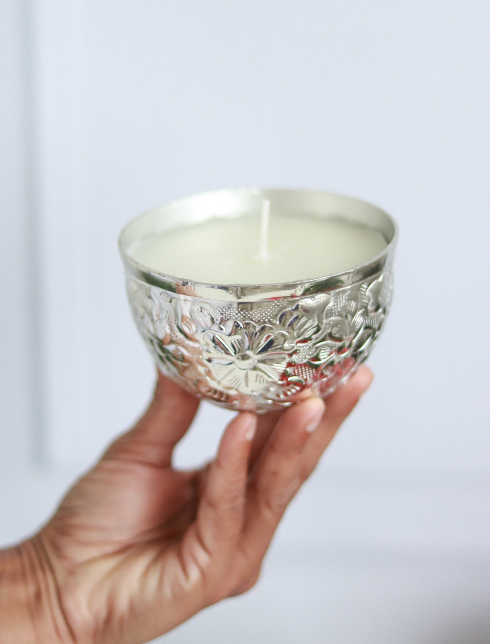 Silver embossed floral scented candle with mogra fragrance in a gift box
