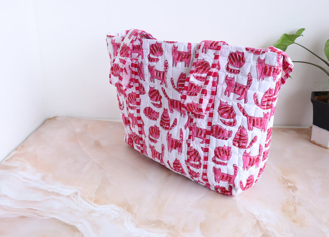 Personalized baby diaper bag in pink cat block print with custom name, stroller friendly, by Kari by Kriti

