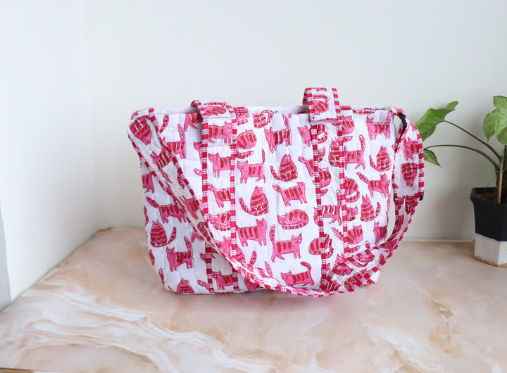 Personalized baby diaper bag in pink cat block print with custom name, stroller friendly, by Kari by Kriti
