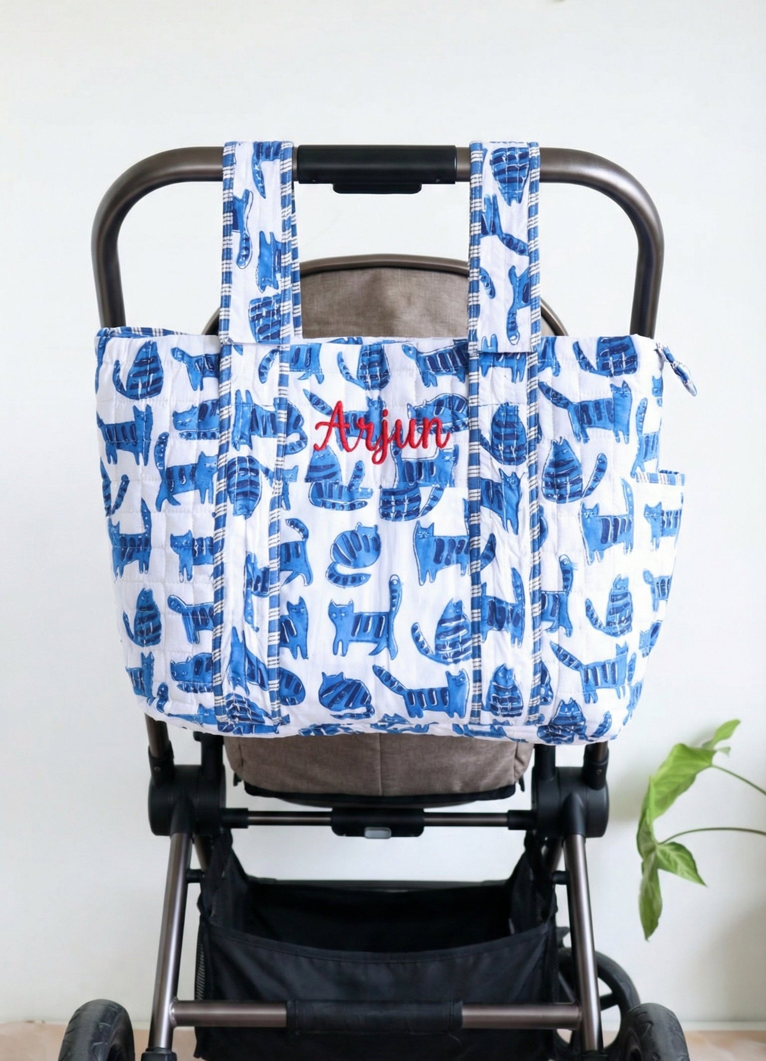 Personalized baby diaper bag in blue cat block print with custom name, stroller friendly, by Kari by Kriti
