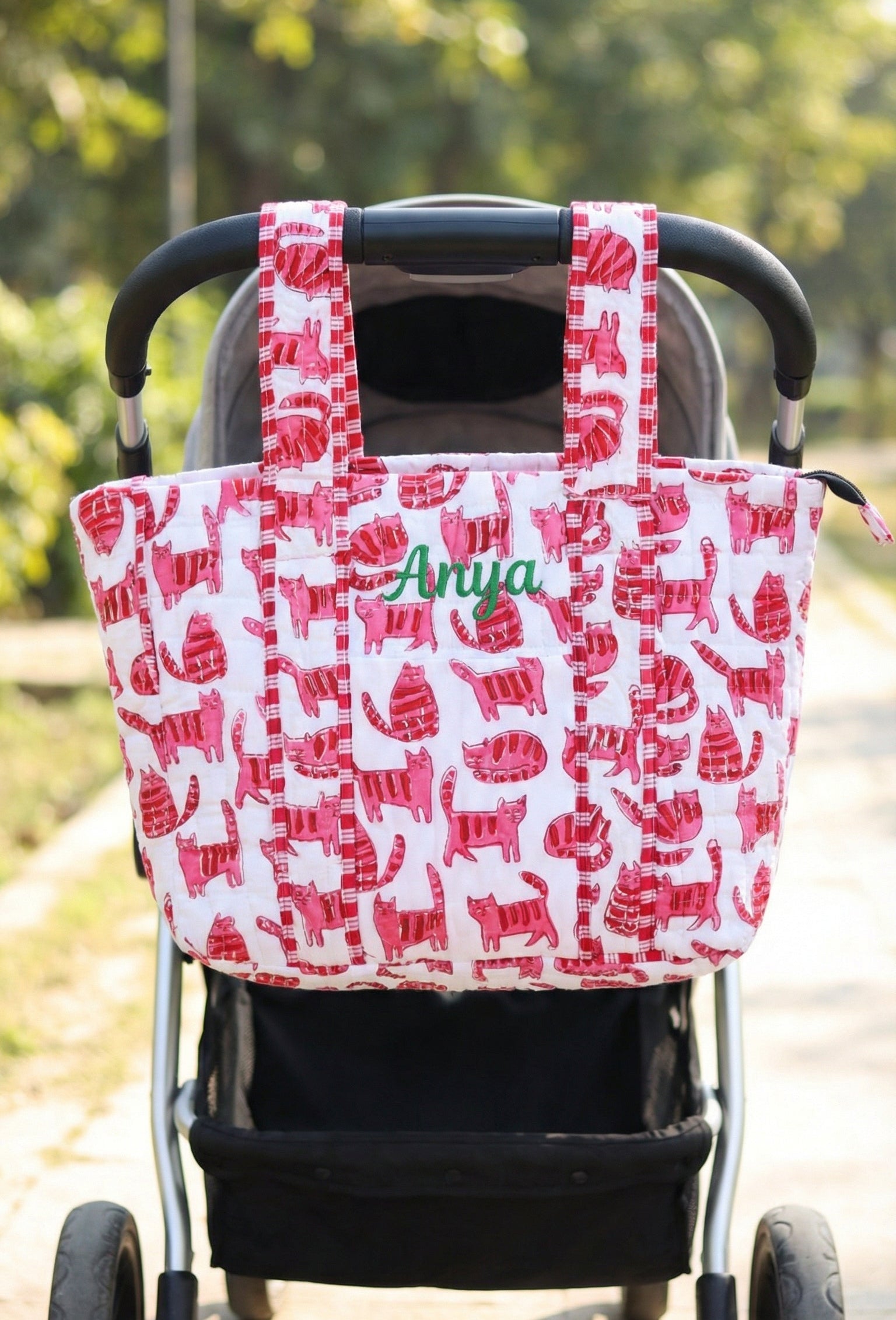 Personalized baby diaper bag in pink cat block print with custom name, stroller friendly, by Kari by Kriti
