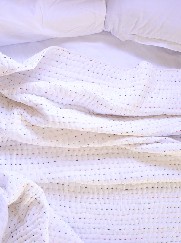 Colourful hand block printed kantha quilt in white - full view