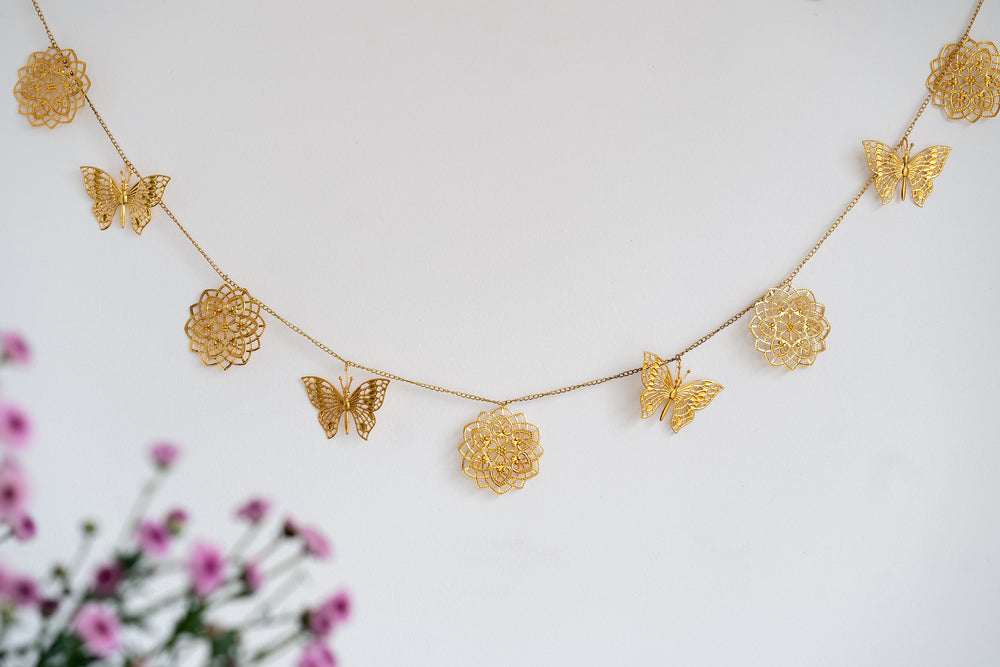 Gold cutwork metal toran with butterfly design for door hanging decoration
