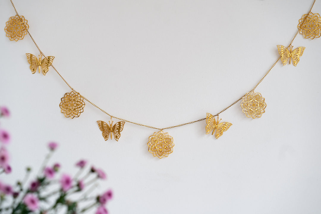 Gold cutwork metal toran with butterfly design for door hanging decoration
