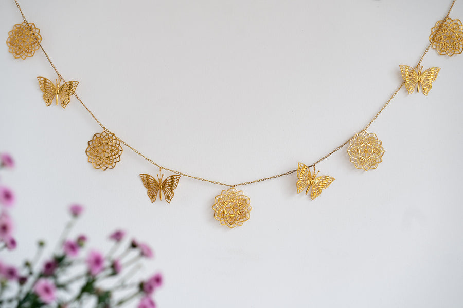 Gold cutwork metal toran with butterfly design for door hanging decoration
