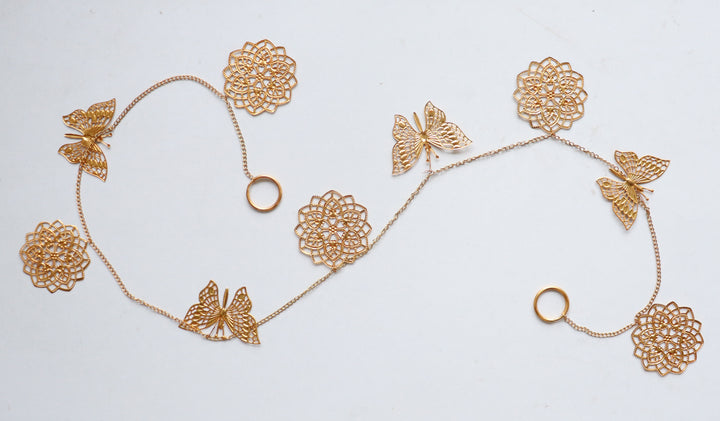 Gold cutwork metal toran with butterfly design for door hanging decoration
