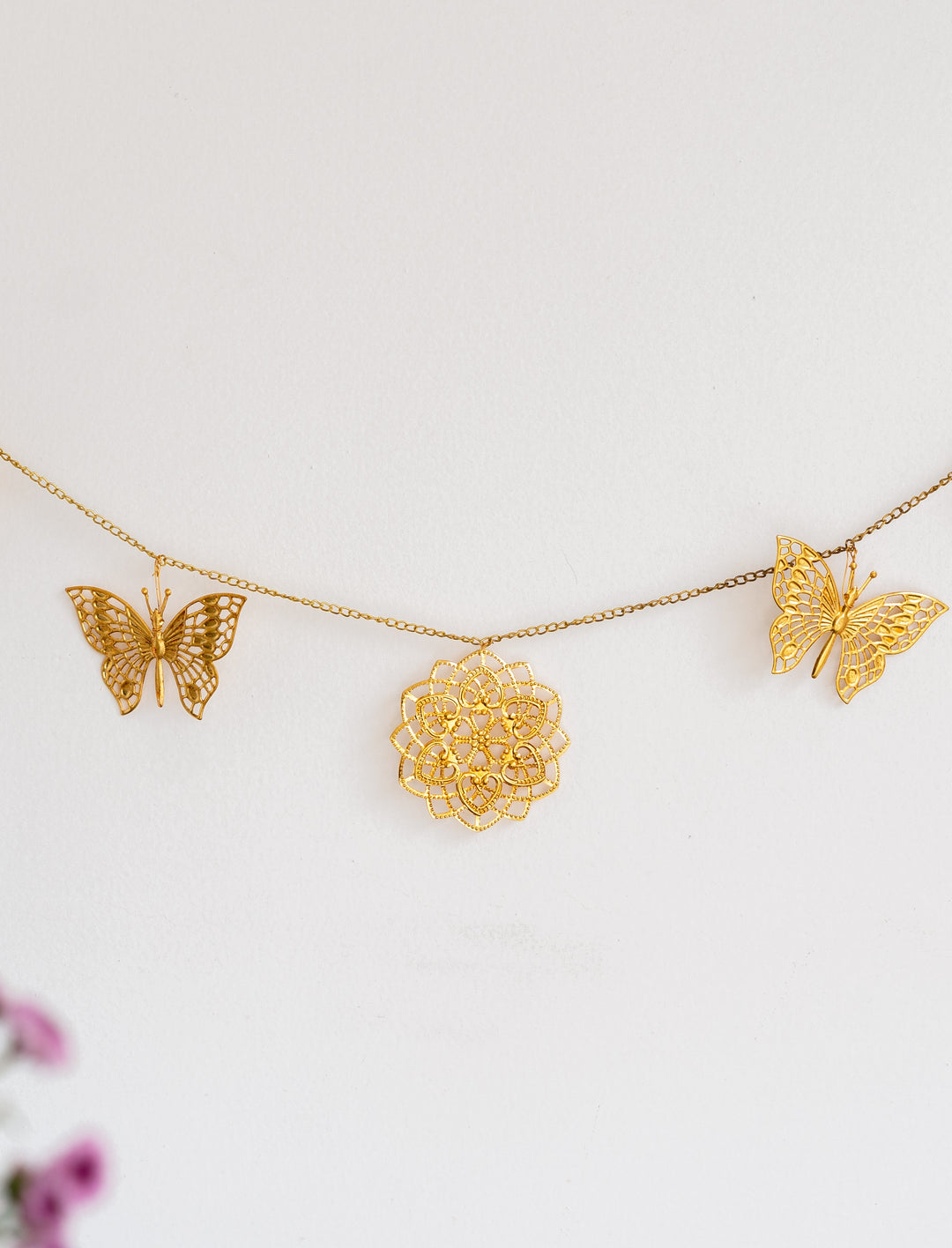 Gold cutwork metal toran with butterfly design for door hanging decoration
