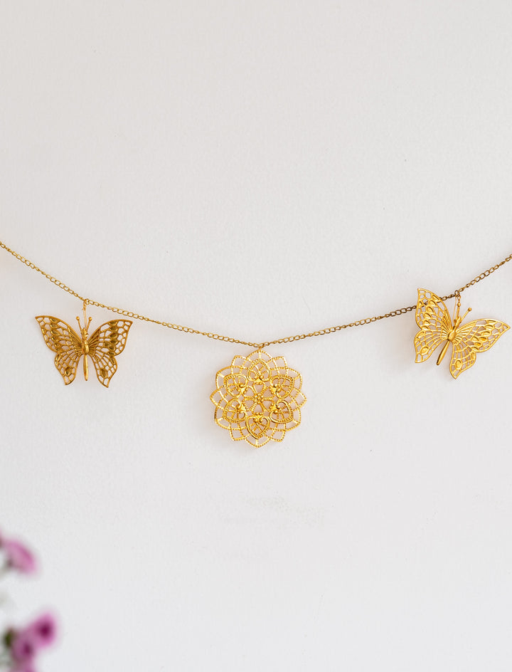 Gold cutwork metal toran with butterfly design for door hanging decoration
