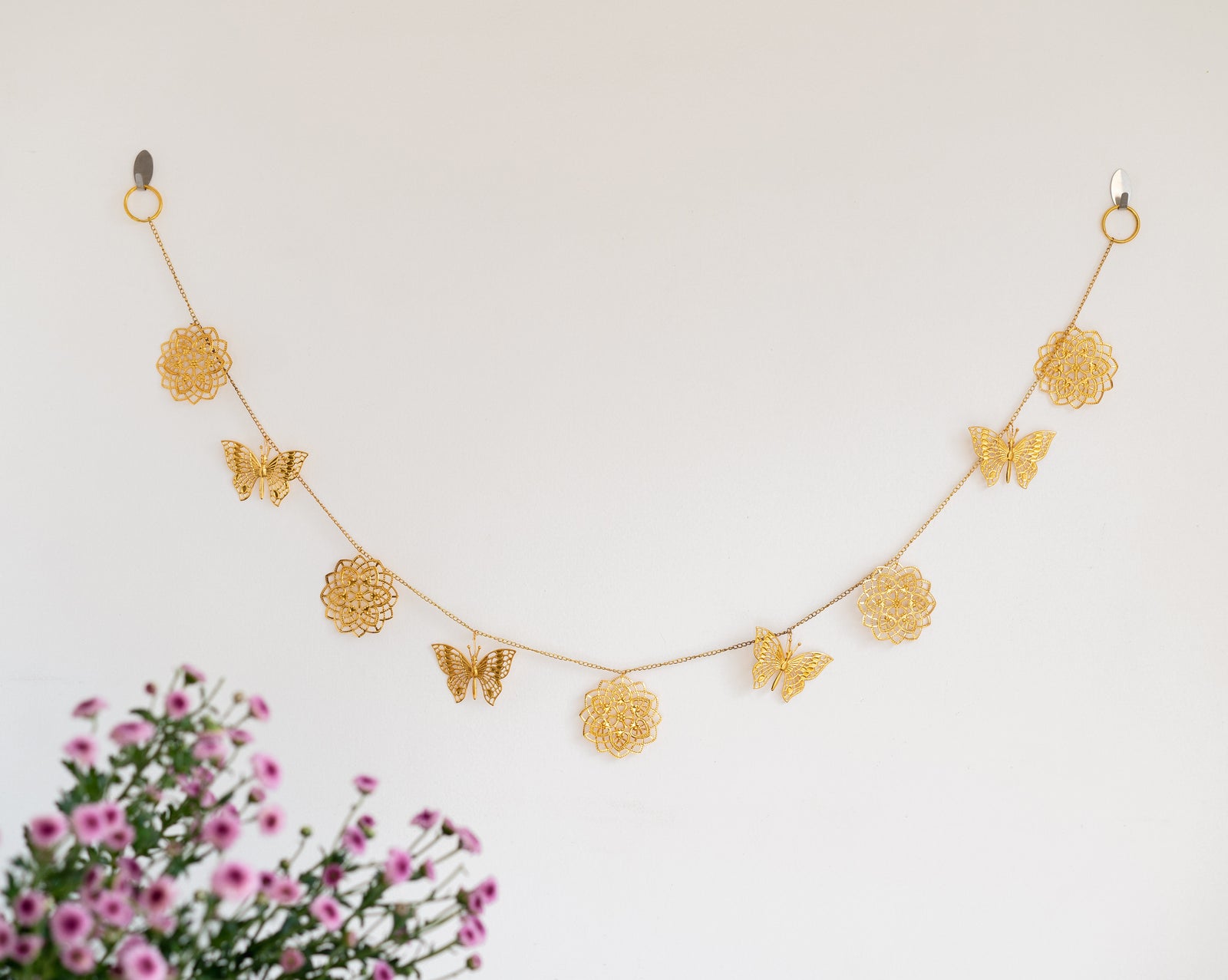 Gold cutwork metal toran with butterfly design for door hanging decoration
